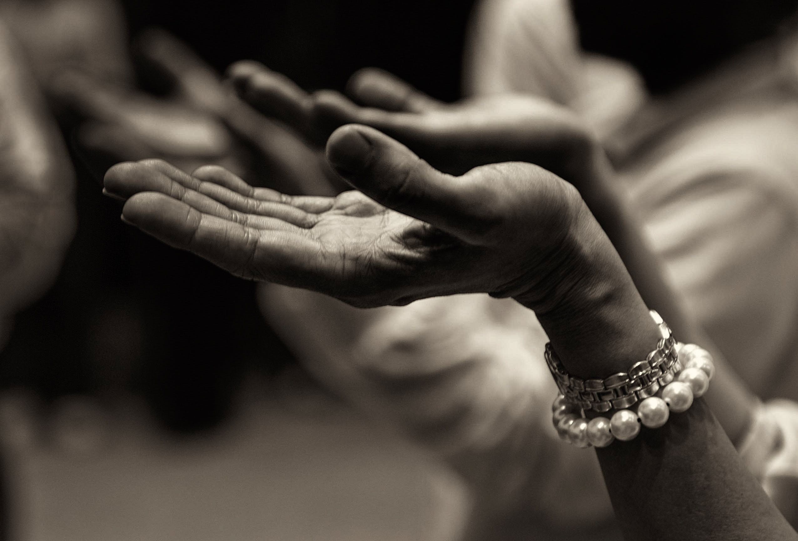 Woman worshipping with hands raised